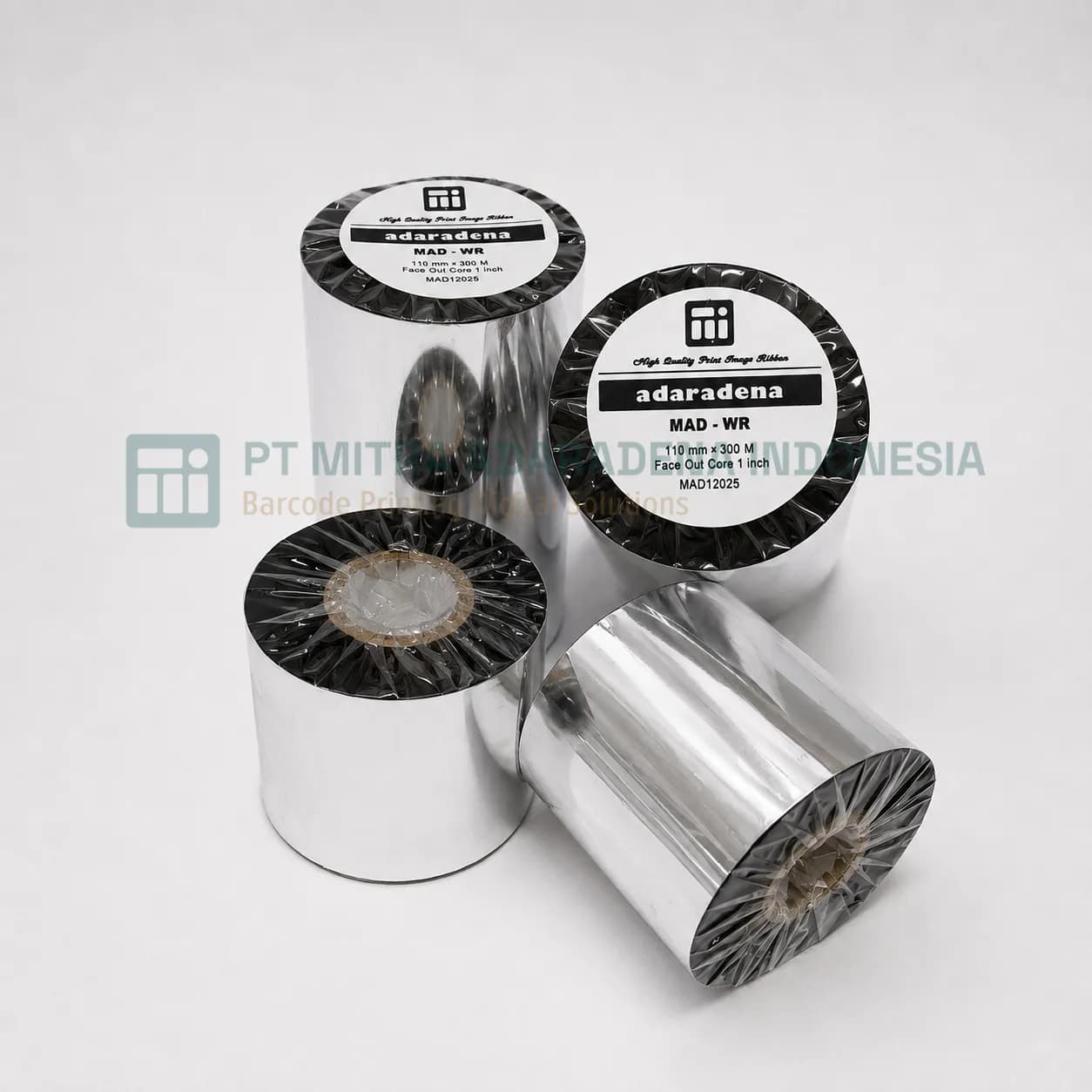 Four rolls of thermal transfer ribbon labelled MAD-WR, two on their sides