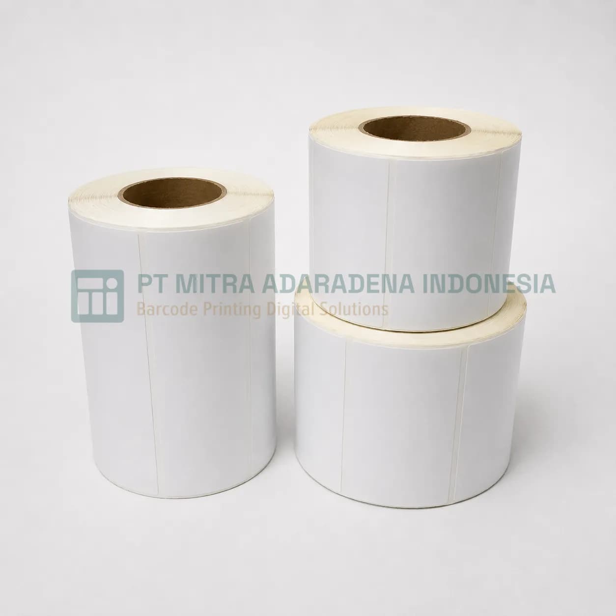 Three rolls of direct thermal label stock in different diameters